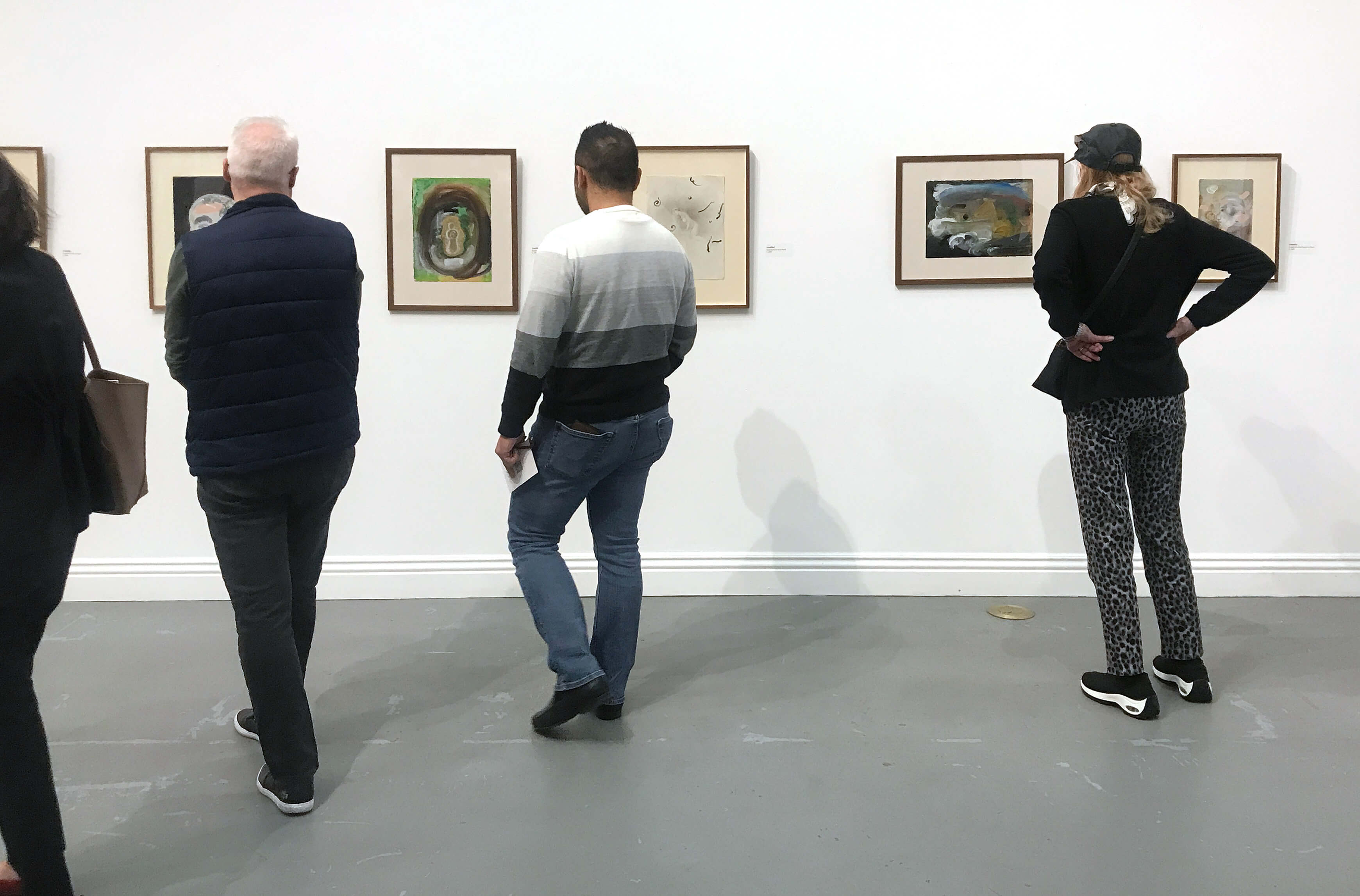 Installation view, Keisho Okayama: Selected Works - Part of the wall of composite mediums: graphic, acrylic and craypas on paper, c. 1994.